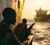 Armed Somali pirates attack container wessels at sea.