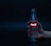 Cola Flasche mit leuchtendem Etikett